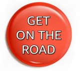 red button with "On The Road" white gradated text