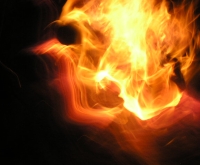 Image of fire, flames in form of a human head profile